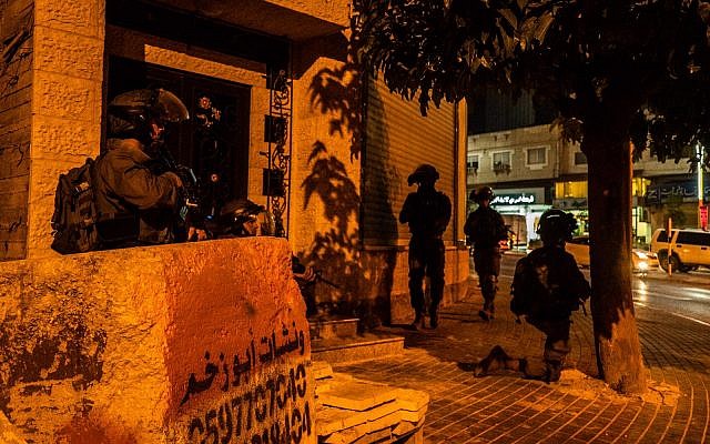 In a picture released by the Israel Defense Forces on August 10, 2019, Israel soldiers search in the West Bank for the terrorists who killed yeshiva student Dvir Sorek. (Israel Defense Forces)