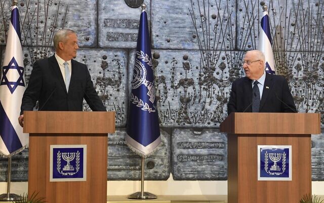 President Reuven Rivlin (R) tasks Blue and White chairman Benny Gantz with forming a government in a ceremony at the President's Residence in Jerusalem on March 16, 2020. (Mark Neyman/GPO)