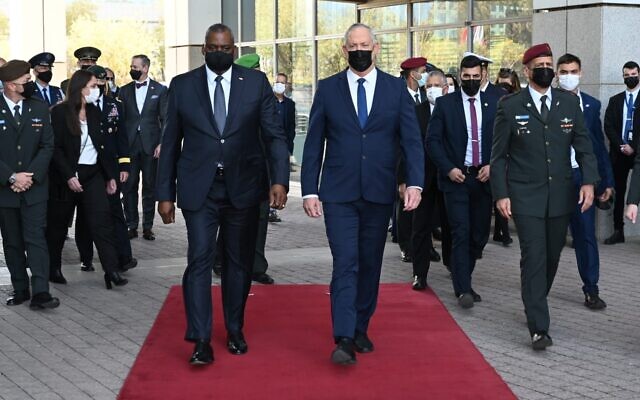 Defense Minister Benny Gantz, right, walks alongside US Defense Secretary Lloyd Austin during an honor guard ceremony at Israel's military headquarters in Tel Aviv on April 11, 2021. (Ariel Hermoni)