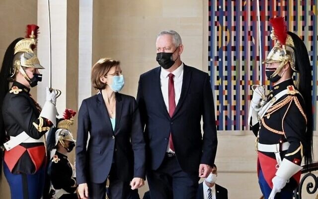 Defense Minister Benny Gantz is greeted by his French counterpart Florence Parly in Paris on July 28, 2021. (Ariel Hermoni/Defense Ministry)